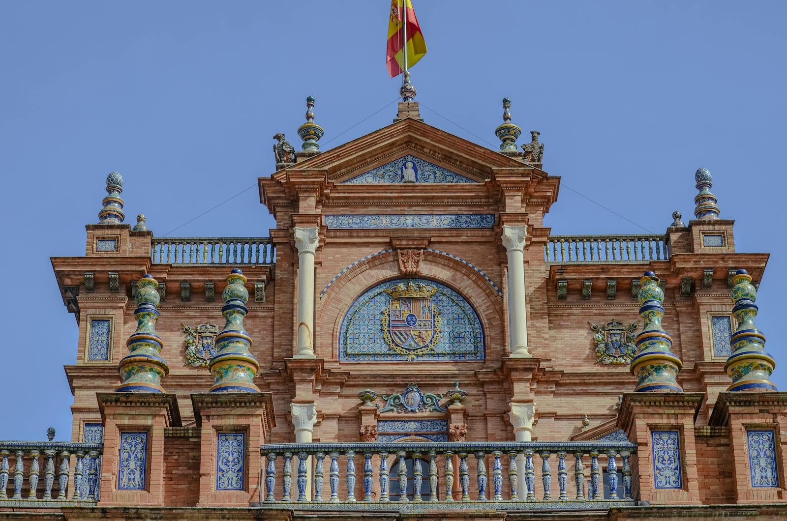 Close-up of Plaza de España's intricate architectural facade in Seville, Spain.